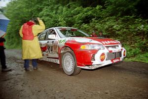 Noel Nash / Bernard Farrell Mitsubishi Lancer Evo IV at the start of the rainy Friday practice stage.