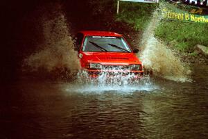 Gail Truess / Jeff Secor Mazda 323GTX at the flying finish of Stony Crossing, SS1.