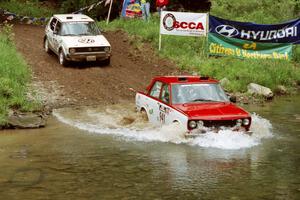 Dan Cook / Bill Rhodes Datsun 510 and Jon Hamilton / Josh Westhoven VW Rabbit at the flying finish of Stony Crossing, SS1.