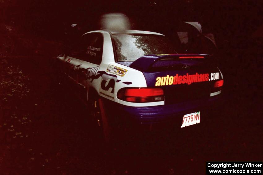 Ramana Lagemann / Russ Hughes Subaru Impreza at the start of the rainy Friday practice stage.