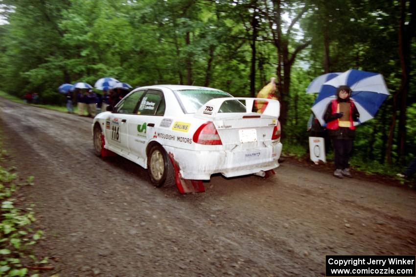 Tom Lawless / Brian Sharkey Mitubishi Lancer Evo IV at the start of the rainy Friday practice stage.