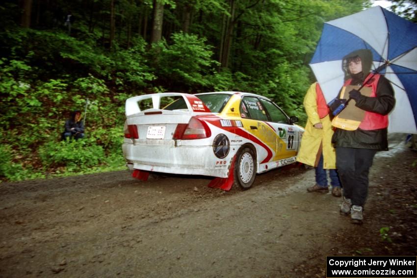 Frank Sprongl / Dan Sprongl Mitsubishi Lancer Evo IV at the start of the rainy Friday practice stage.