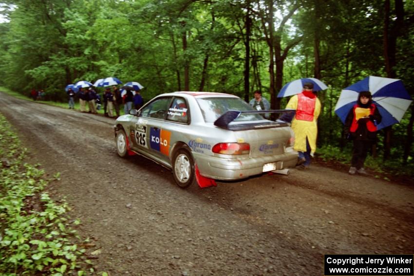 Sakis Hadjiminas / Luis Figueiredo Subaru Impreza at the start of the rainy Friday practice stage.