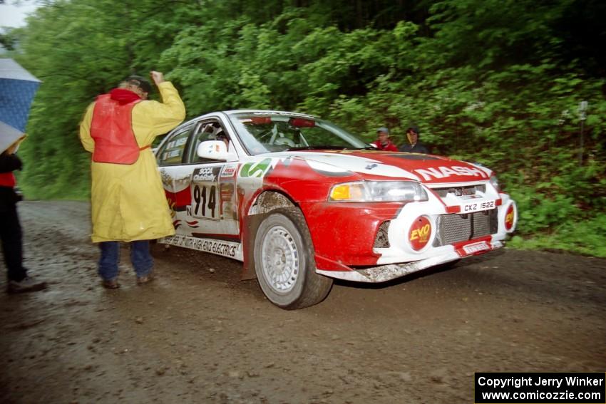 Noel Nash / Bernard Farrell Mitsubishi Lancer Evo IV at the start of the rainy Friday practice stage.