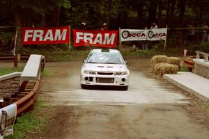 Seamus Burke / Frank Cunningham Mitsubishi Lancer Evo VI comes through the spectator area at Phasa, SS4.