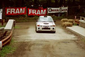 Tom Lawless / Brian Sharkey Mitubishi Lancer Evo IV comes through the spectator area at Phasa, SS4.