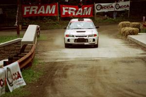 Tim Paterson / Scott Ferguson Mitsubishi Lancer Evo IV comes through the spectator area at Phasa, SS4.