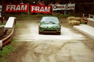 Tad Ohtake / Martin Dapot Ford Escort ZX2 comes through the spectator area at Phasa, SS4.