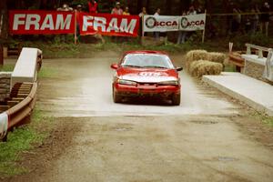 Wojciech Hajduczyk / Chuck Cox Plymouth Laser comes through the spectator area at Phasa, SS4.