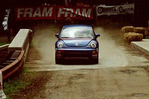 Mike Halley / Ole Holter VW New Beetle comes through the spectator area at Phasa, SS4.