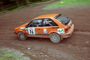 Gail Truess / Jeff Secor Mazda 323GTX at the first hairpin on Colton Stock, SS5.