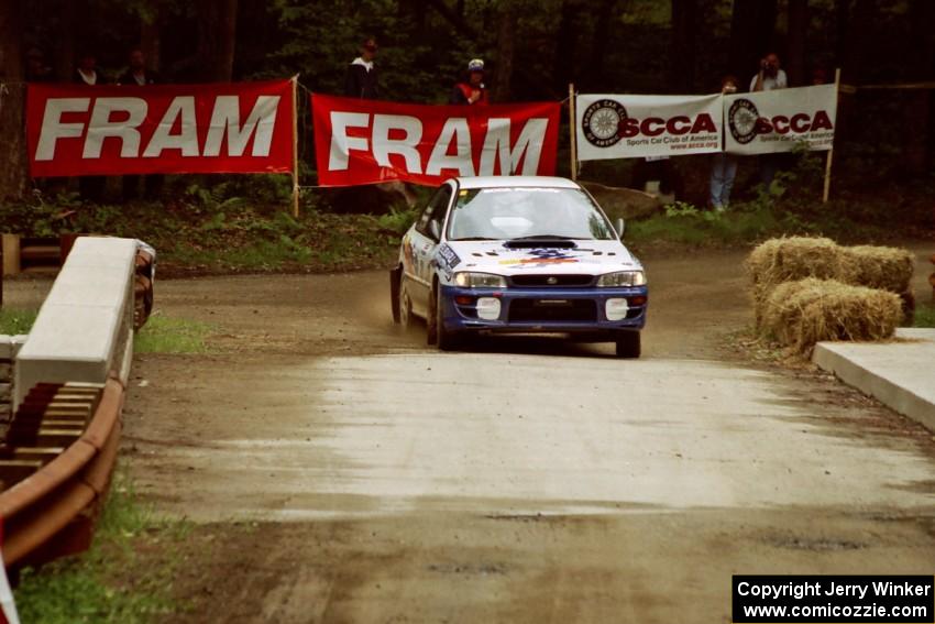 Ramana Lagemann / Russ Hughes Subaru Impreza comes through the spectator area at Phasa, SS4.