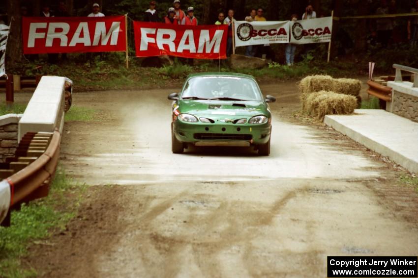 Tad Ohtake / Martin Dapot Ford Escort ZX2 comes through the spectator area at Phasa, SS4.