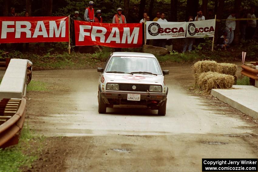 Tony Chavez / Doug Robinson VW GTI comes through the spectator area at Phasa, SS4.