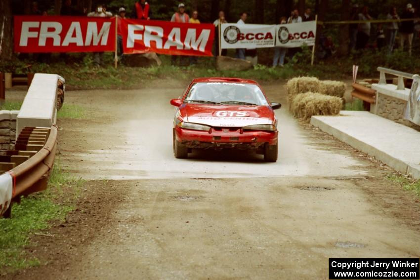 Wojciech Hajduczyk / Chuck Cox Plymouth Laser comes through the spectator area at Phasa, SS4.