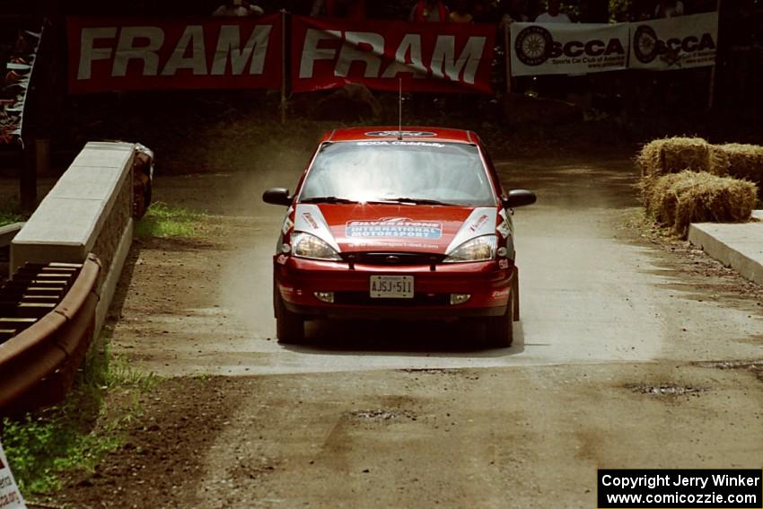 Peter Reilly / Ray Felice Ford Focus comes through the spectator area at Phasa, SS4.