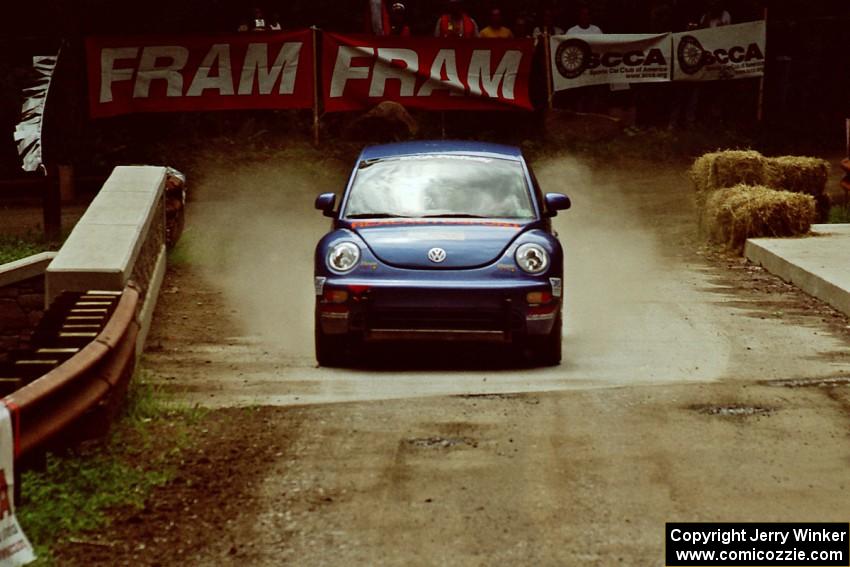 Mike Halley / Ole Holter VW New Beetle comes through the spectator area at Phasa, SS4.