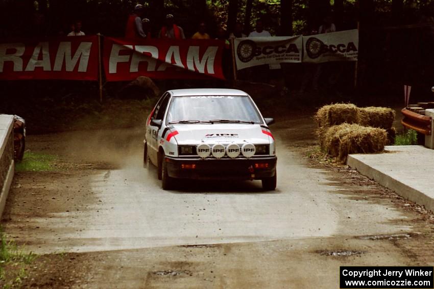 Jeff Field / Dave Weiman Dodge Shadow comes through the spectator area at Phasa, SS4.