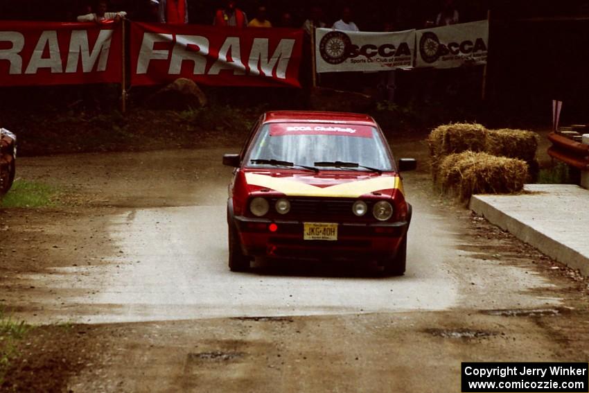 Dmitri Kishkarev / Scott Comens VW GTI comes through the spectator area at Phasa, SS4.