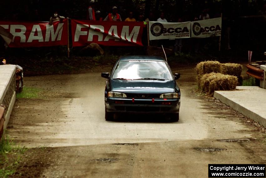 Don Kennedy / Matt Kennedy Subaru Impreza comes through the spectator area at Phasa, SS4.