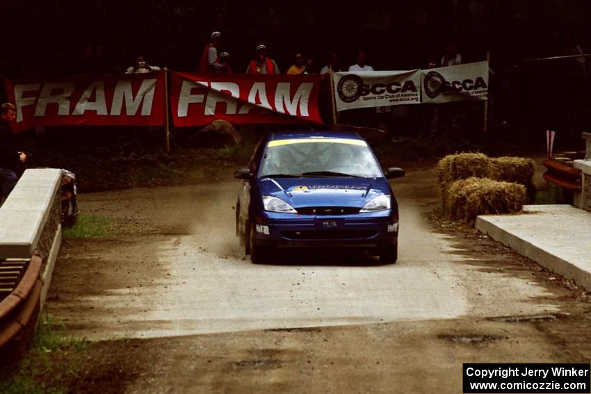 Craig Peeper / Ian Bevan Ford Focus comes through the spectator area at Phasa, SS4.