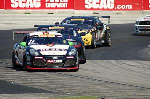 Jack Baldwin's Porsche Cayman, Michael Cooper's Chevy Camaro Z28 and Lou Gigliotti's Aston Martin Vantage GT4