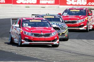 Mark Wilkins' Kia Optima, Dan Martinson's Ford Mustang Boss 302 and Ben Clucas' Kia Optima