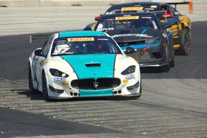 Gianmarco Raimondo's Maserati GrandTurismo MC, Tony Gaples' Chevy Camaro Z28 and Preston Calvert's Ford Mustang Boss 302