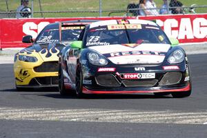 Jack Baldwin's Porsche Cayman and Lou Gigliotti's Aston Martin Vantage GT4