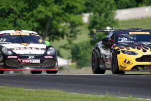 Lou Gigliotti's Aston Martin Vantage GT4 passes Jack Baldwin's Porsche Cayman