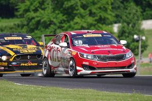 Mark Wilkins' Kia Optimaand Andrew Aquilante's Ford Mustang Boss 302