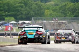 Nick Mancuso's Maserati GrandTurismo MC chases Dan Martinson's Ford Mustang Boss 302