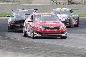 Mark Wilkins' Kia Optima, Jack Roush, Jr.'s Ford Mustang Boss 302 and Jack Baldwin's Porsche Cayman