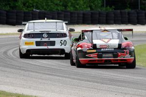 Jack Baldwin's Porsche Cayman chases Dean Martin's Ford Mustang Boss 302