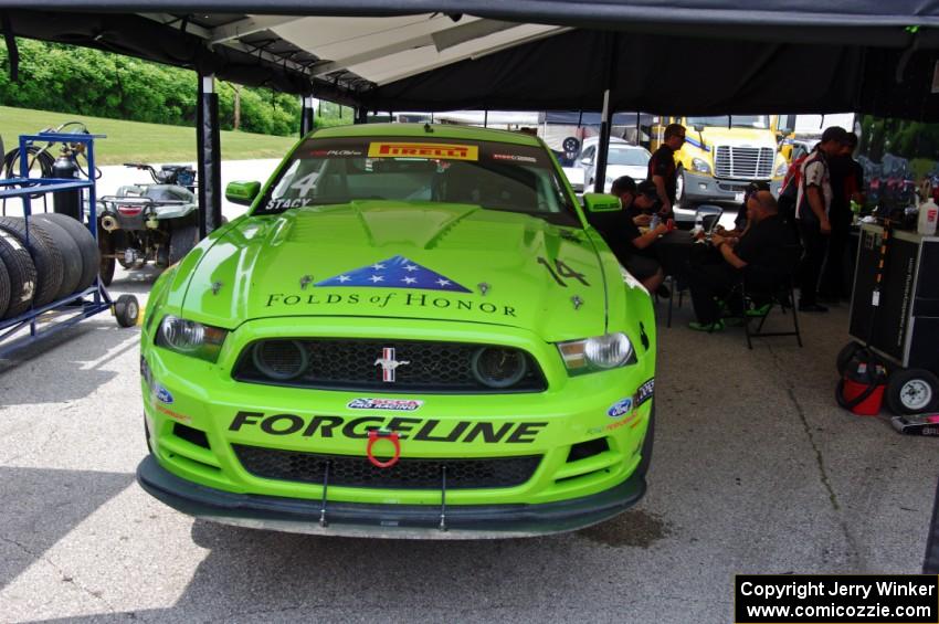 Nate Stacy's Ford Mustang Boss 302 in the paddock.