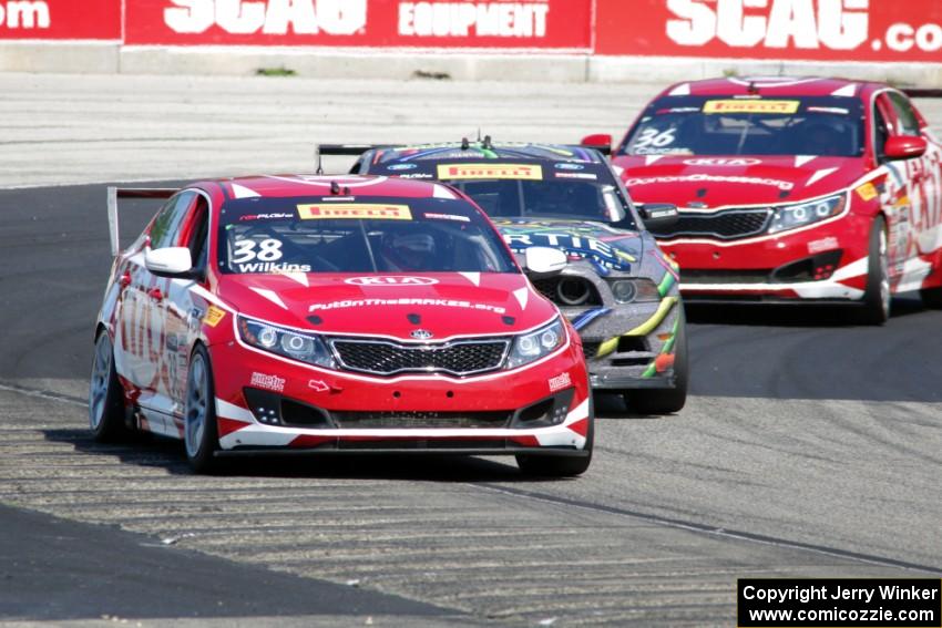 Mark Wilkins' Kia Optima, Dan Martinson's Ford Mustang Boss 302 and Ben Clucas' Kia Optima