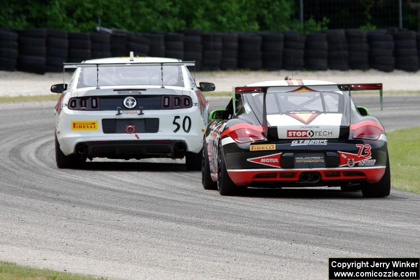 Jack Baldwin's Porsche Cayman chases Dean Martin's Ford Mustang Boss 302