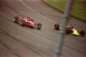 Jimmy Vasser's Reynard 96i/Honda about to put a lap on André Ribeiro's Lola T-96/00/Honda