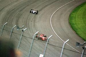 Jimmy Vasser's Reynard 96i/Honda ahead of Eddie Lawson's Lola T-96/00/Mercedes