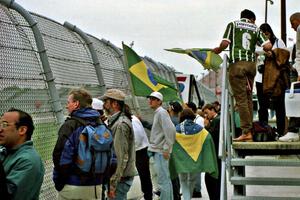 Brazilian fans near start/finish.