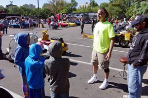 Rich Laybis chats to a group of kids about foregn cars.