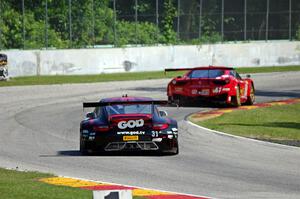 Ryan Dalziel's Porsche 911 GT3R chases Olivier Beretta's Ferrari 458 GT3 Italia