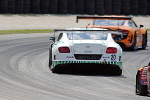 Butch Leitzinger's Bentley Continental GT3 chases Mike Skeen's Audi R8 LMS Ultra