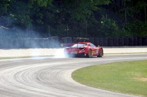 Olivier Beretta's Ferrari 458 GT3 Italia limps through the carousel