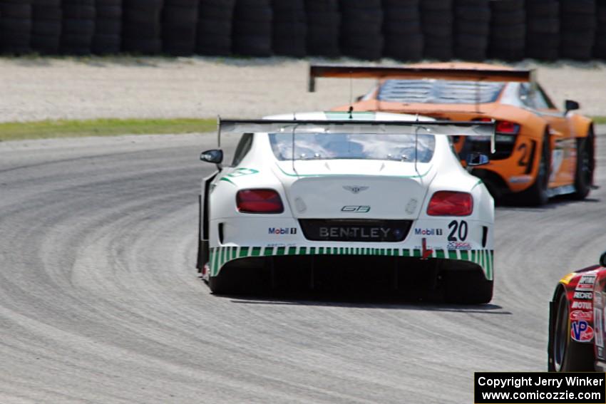 Butch Leitzinger's Bentley Continental GT3 chases Mike Skeen's Audi R8 LMS Ultra