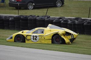 Gary Moore's Ford GT40 Mk. IV crashes at turn 7.
