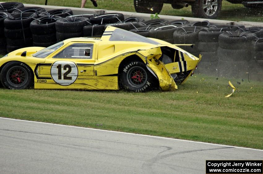 Gary Moore's Ford GT40 Mk. IV crashes at turn 7.