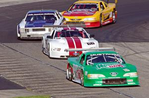 Colin Comer's Ford Mustang, Denny Lamers' Ford Mustang, Shane Lewis' Chevy Nova and Adam Rupp's Ford Mustang