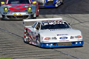 Scott Heider's Ford Mustang Cobra and Tom Minnich's Porsche GT3 RSR