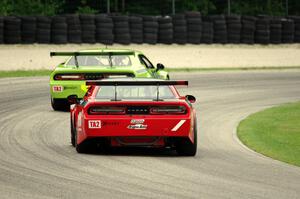 Cameron Lawrence's Dodge Challenger chases Joe Stevens' Dodge Challenger